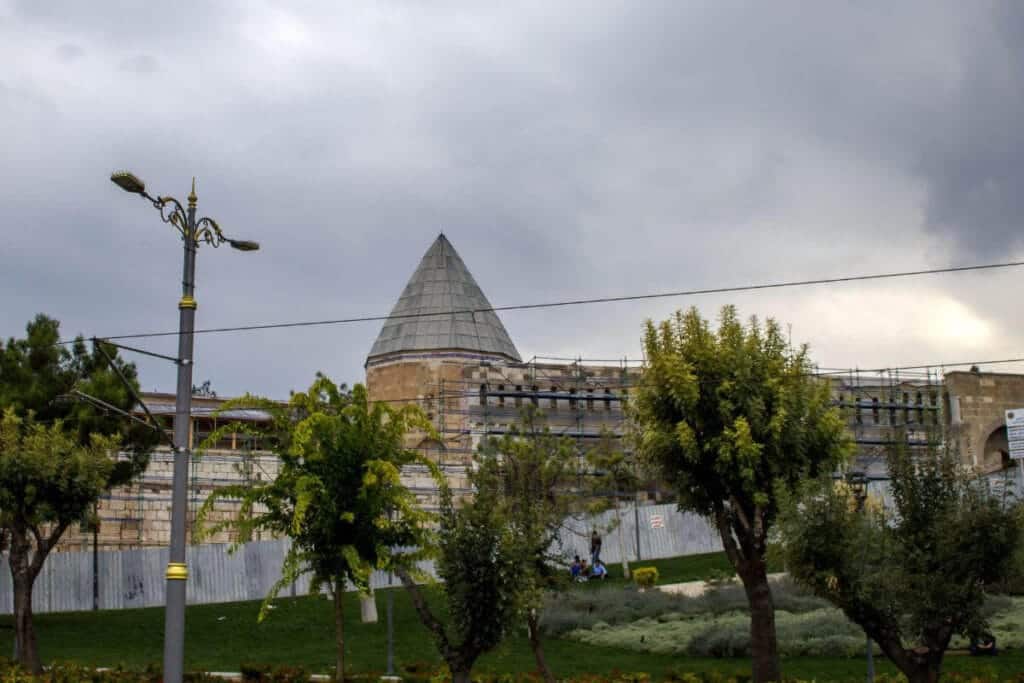 Alaaddin Mosque in Konya, Turkey, under restoration, with Seljuk-style conical dome and stone architecture.